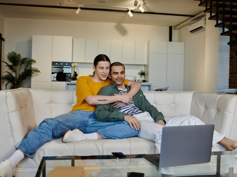 Couple hugging on the couch